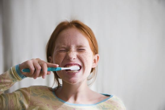 Kid brushing teeth
