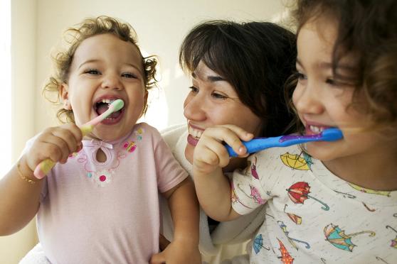 Kids brushing their teeth